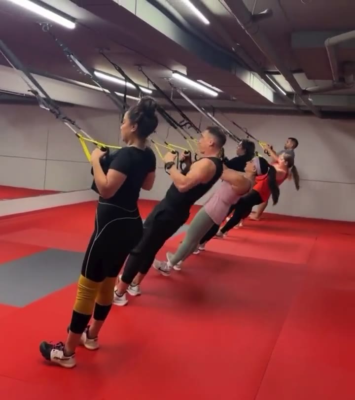 TRX rows in the red studio at DKM Academy