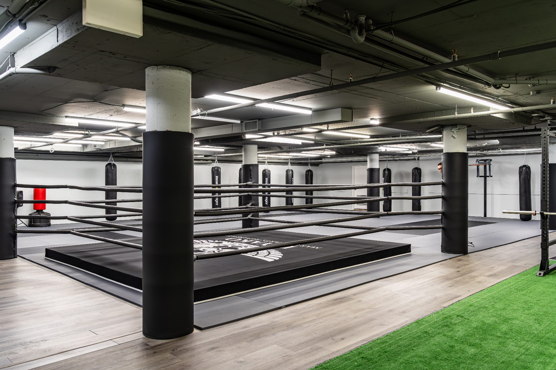 Wide view of the boxing ring and heavy bag area